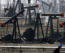 В МЭА приближения нефтерынка к балансу ждут уже в 2016 г.